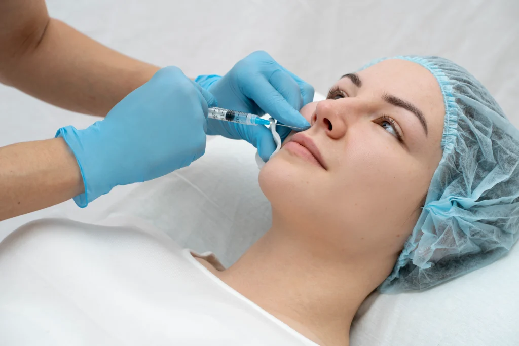 A woman getting a nose filler.
