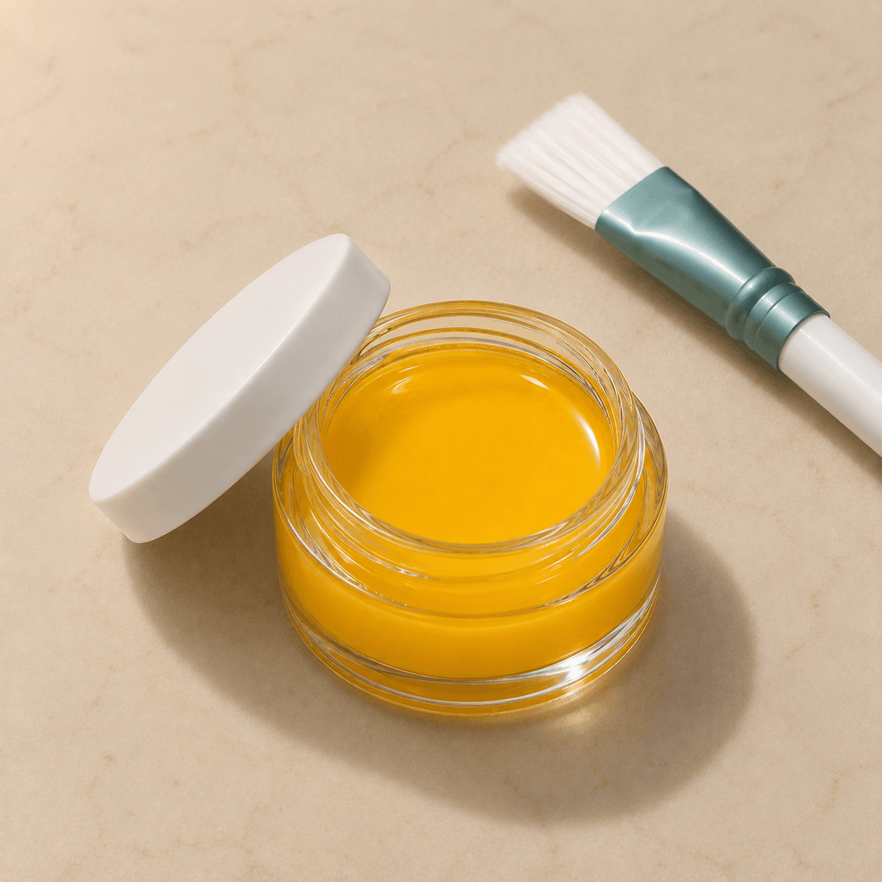 Isometric shot of a glass jar of rich golden-yellow Inno/Yellow peel solution, lid resting beside it, with a clinical brush accented in muted teal.